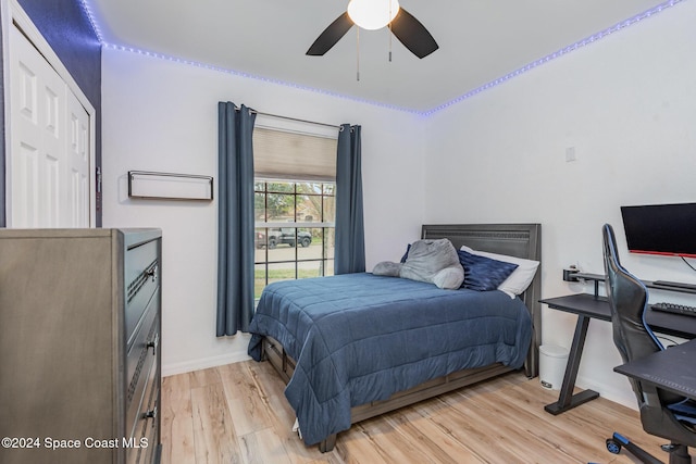 bedroom with ceiling fan and light hardwood / wood-style flooring