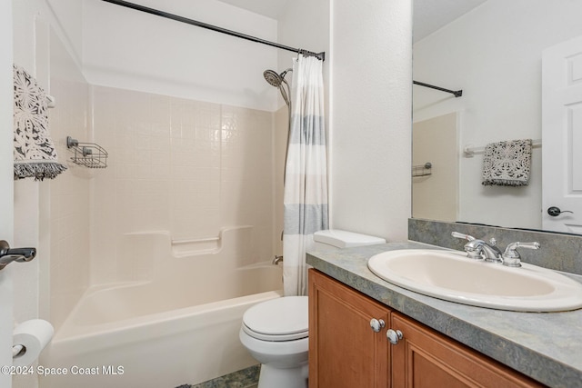 full bathroom with vanity, toilet, and shower / bath combo with shower curtain