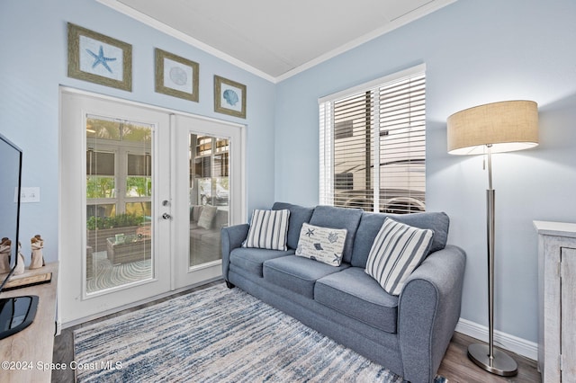 living room with french doors, ornamental molding, and hardwood / wood-style flooring