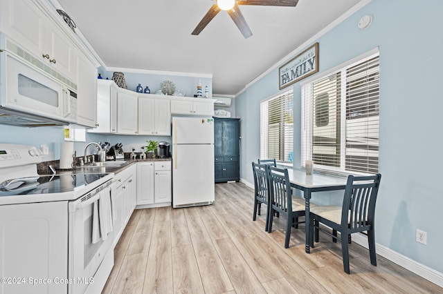 kitchen with white appliances, sink, crown molding, light hardwood / wood-style flooring, and white cabinetry