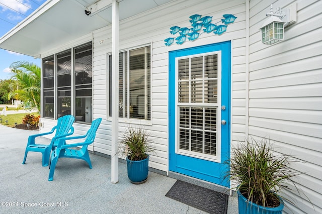 doorway to property with a porch