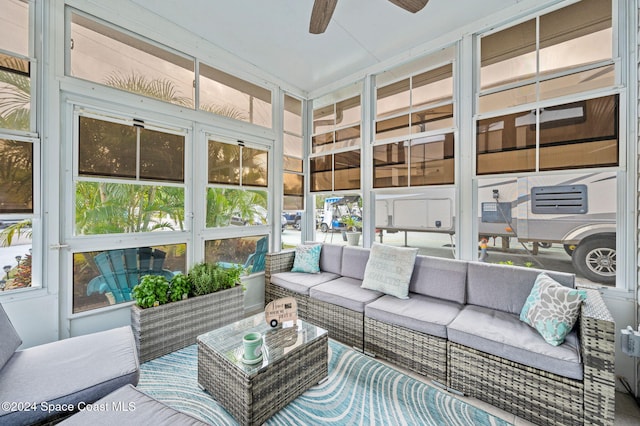 sunroom with a wealth of natural light and ceiling fan