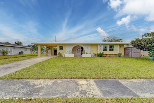 ranch-style house with a front lawn and a carport