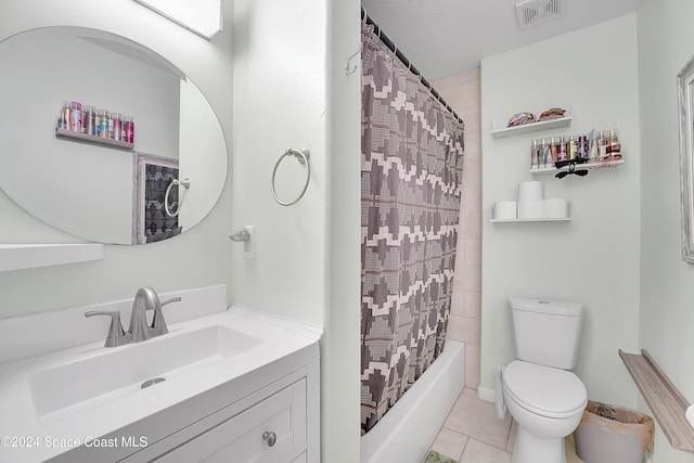 full bathroom with vanity, tile patterned floors, toilet, shower / bath combo with shower curtain, and a textured ceiling