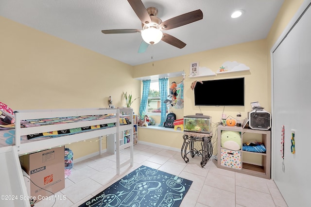 bedroom featuring tile patterned floors and ceiling fan