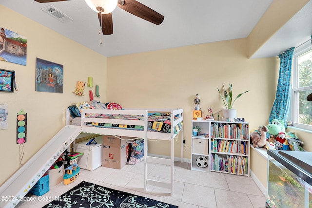 bedroom featuring ceiling fan and light tile patterned flooring