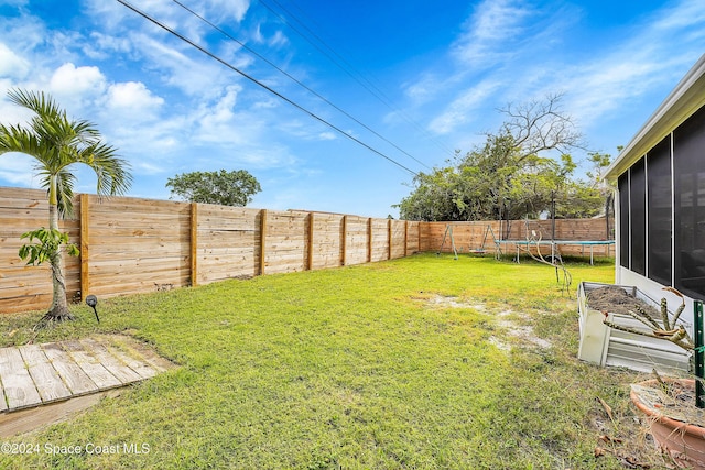 view of yard featuring a trampoline