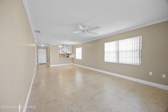 unfurnished room featuring crown molding and ceiling fan