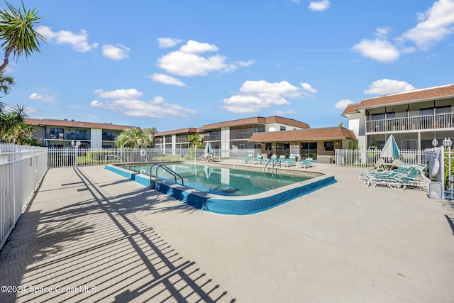 view of pool featuring a patio