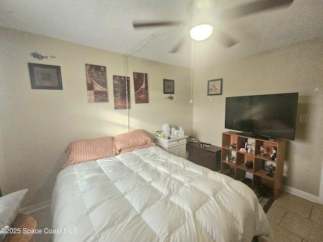 tiled bedroom with ceiling fan