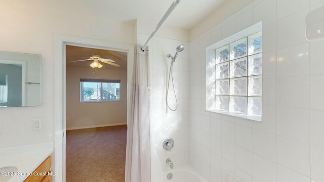 bathroom featuring vanity, ceiling fan, and shower / tub combo with curtain