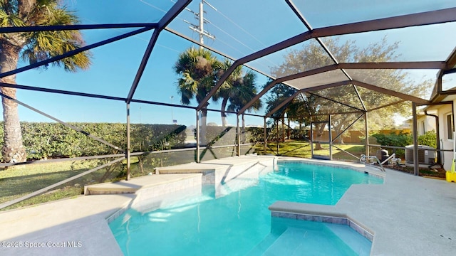 view of pool with central AC unit and a lanai