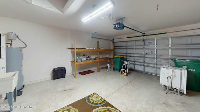 garage with electric water heater and a garage door opener