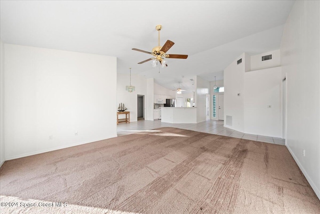 unfurnished living room with ceiling fan, light carpet, and high vaulted ceiling