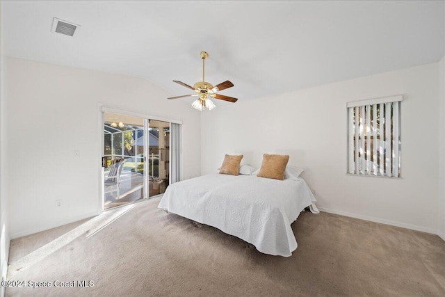 bedroom featuring access to outside, ceiling fan, carpet, and vaulted ceiling