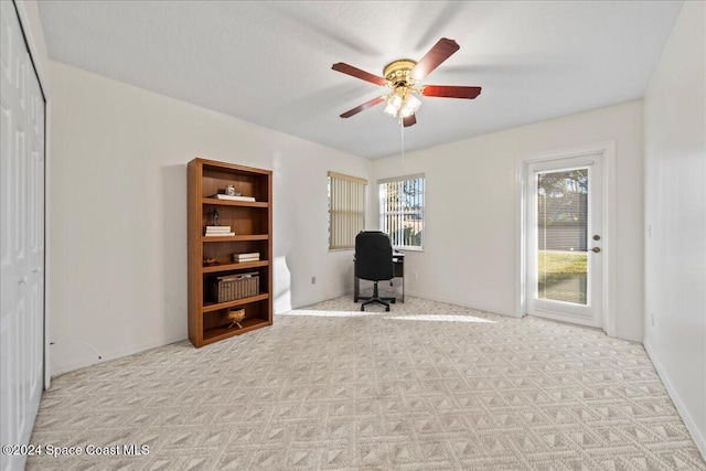 unfurnished office with light carpet and ceiling fan