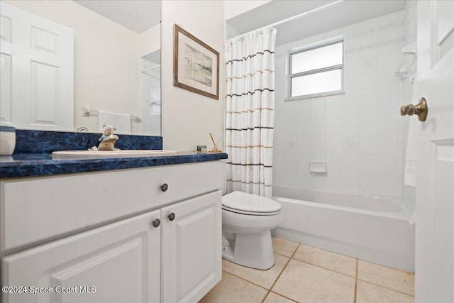 full bathroom featuring tile patterned flooring, shower / bath combo, vanity, and toilet