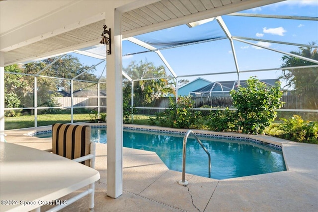 view of pool featuring a patio area and a lanai