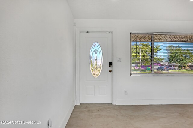 view of carpeted foyer