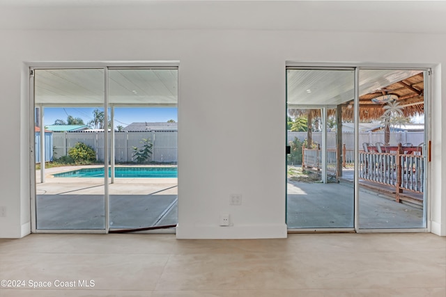 doorway with concrete flooring and a wealth of natural light