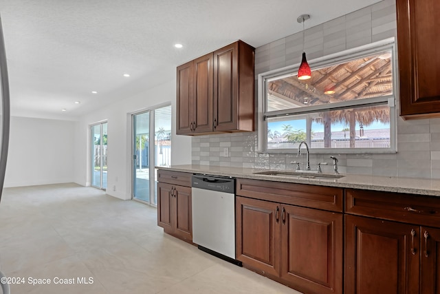 kitchen with dishwasher, tasteful backsplash, plenty of natural light, and sink