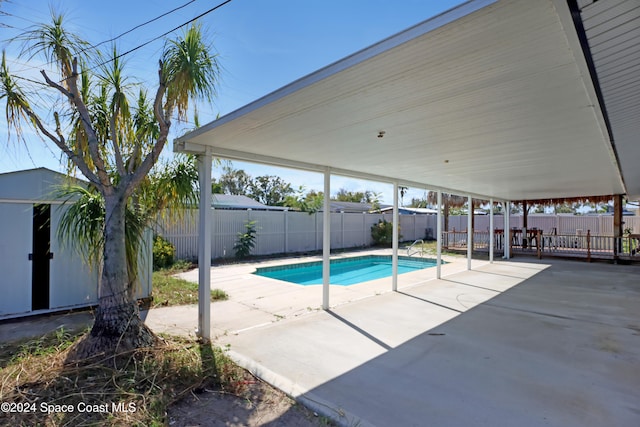 view of swimming pool with a patio