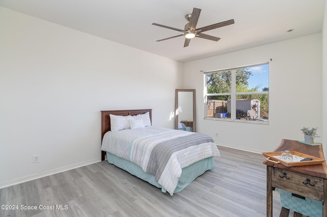 bedroom featuring ceiling fan and light hardwood / wood-style floors