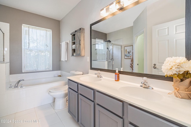 full bathroom featuring tile patterned floors, separate shower and tub, vanity, and toilet