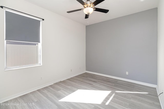 spare room with ceiling fan and light hardwood / wood-style floors