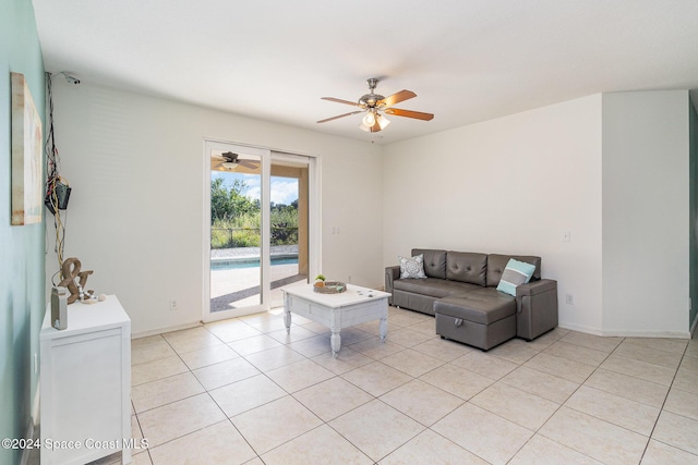 living room with light tile patterned floors and ceiling fan