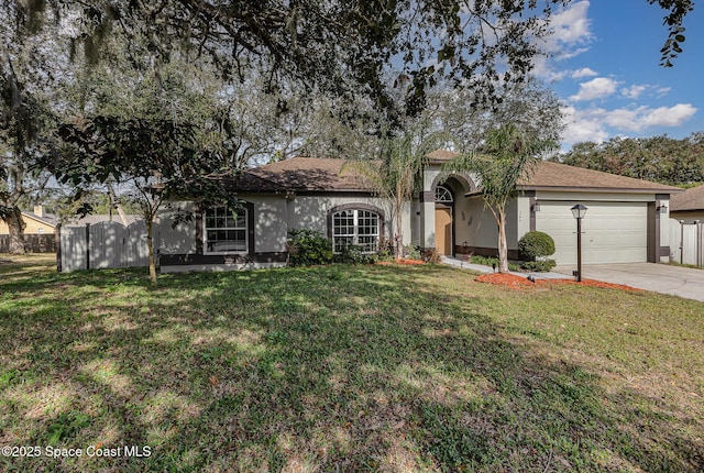 view of front of home featuring a garage and a front yard