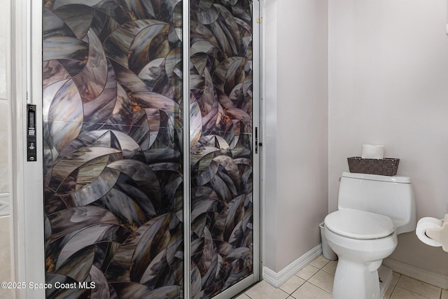 bathroom with tile patterned floors and toilet