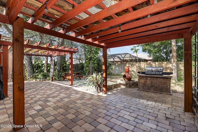 view of patio / terrace featuring an outdoor kitchen, area for grilling, and a pergola