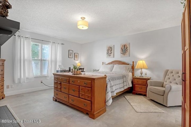 bedroom featuring a textured ceiling