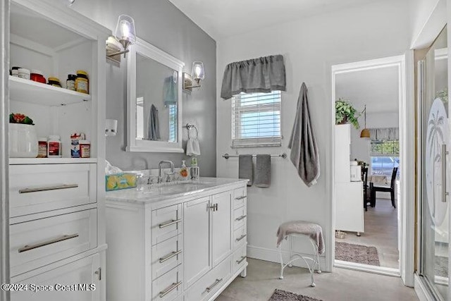 bathroom featuring a wealth of natural light and vanity