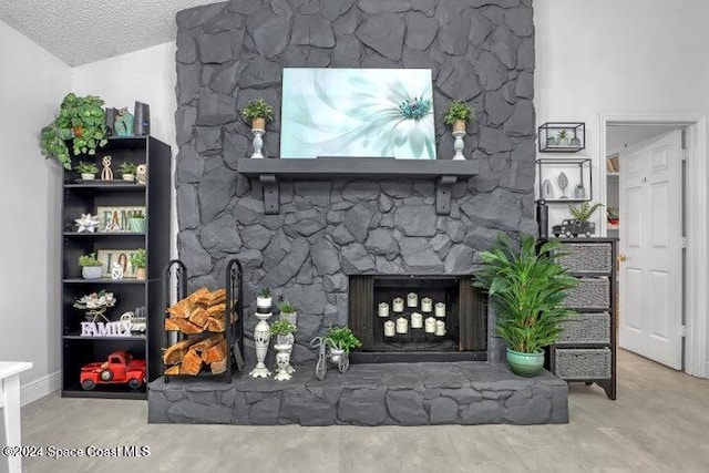 interior space with a textured ceiling and a fireplace