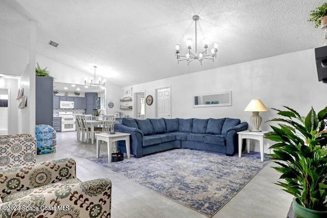 living room with a textured ceiling, an inviting chandelier, and lofted ceiling