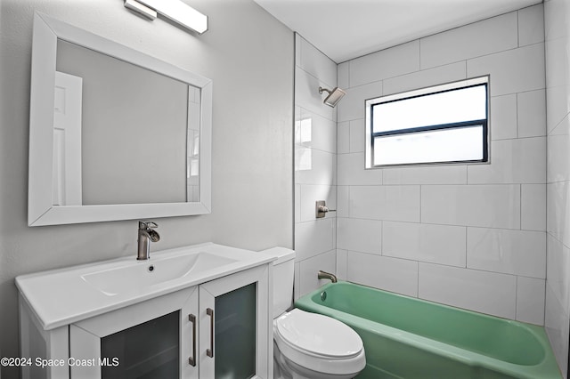 full bathroom with vanity, toilet, and tiled shower / bath