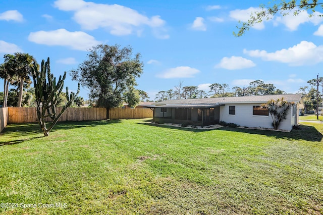 view of yard with a sunroom