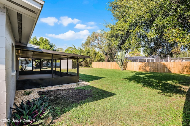 view of yard featuring a sunroom