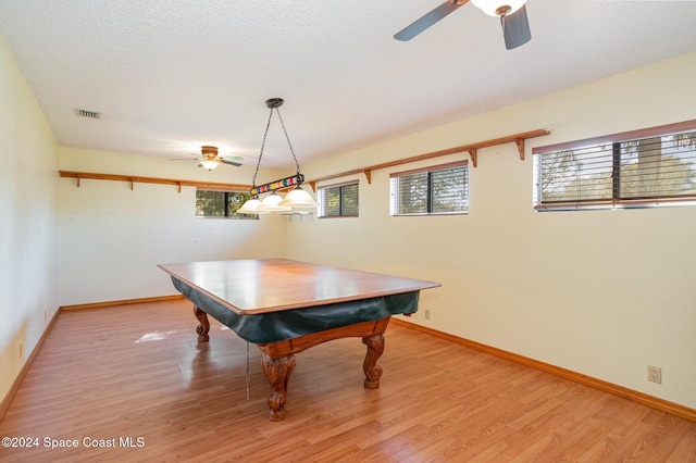 rec room with a textured ceiling, light hardwood / wood-style flooring, ceiling fan, and pool table