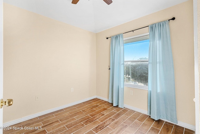 unfurnished room featuring wood finish floors, ceiling fan, and baseboards