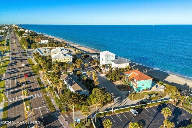 aerial view featuring a view of the beach and a water view