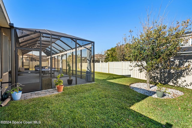 view of yard featuring a lanai