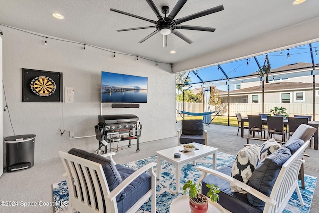 view of patio featuring outdoor lounge area, area for grilling, and ceiling fan