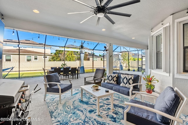 sunroom / solarium with ceiling fan