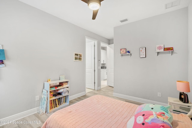 bedroom featuring light wood-type flooring and ceiling fan