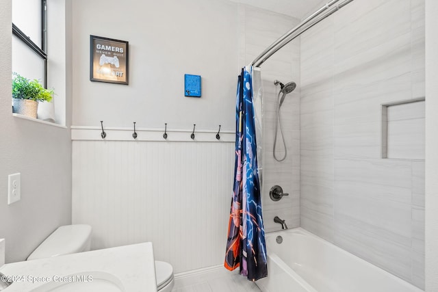 bathroom with shower / bath combination with curtain and toilet