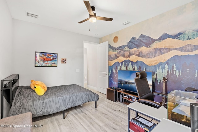 bedroom with ceiling fan and hardwood / wood-style floors