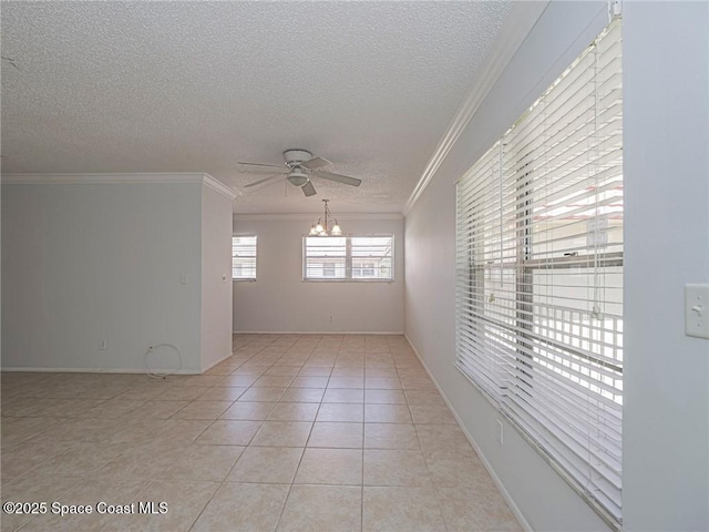 28 Pine Arbor Ln Unit 206, Vero Beach, FL 32962 - spare room with crown molding, light tile patterned flooring, baseboards, a textured ceiling, and ceiling fan with notable chandelier